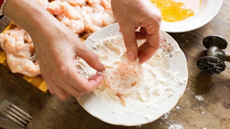 dredging chicken in flour