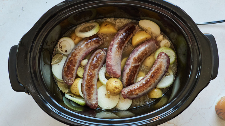 Bratwursts and vegetables in slow cooker