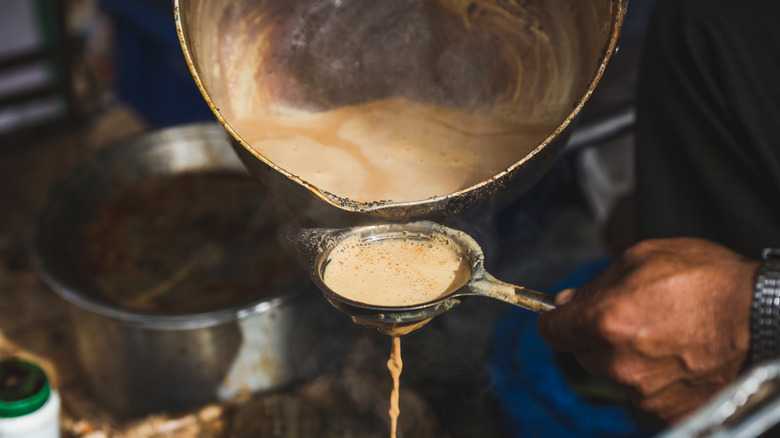 straining chai