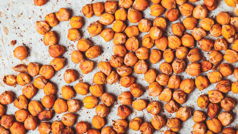 Top-down view of chickpeas on a baking sheet