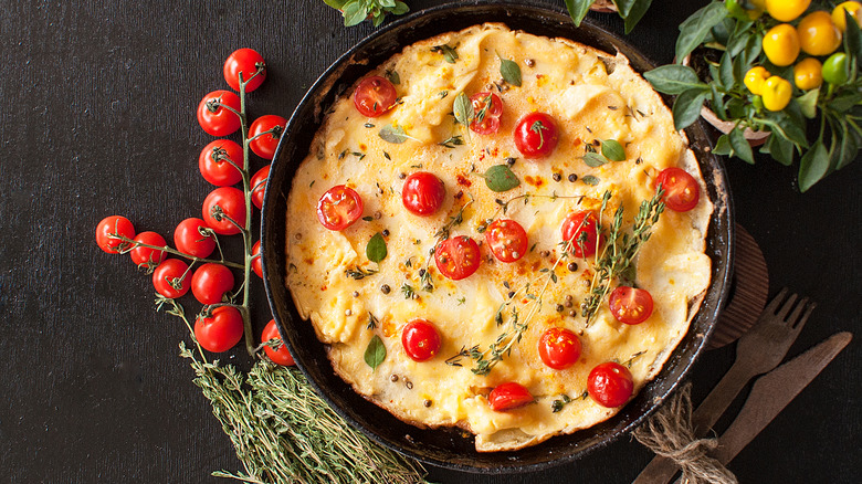 pizza crust with cheese and tomatoes