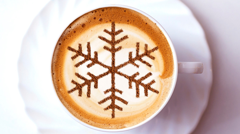 cinnamon snowflake on coffee cup