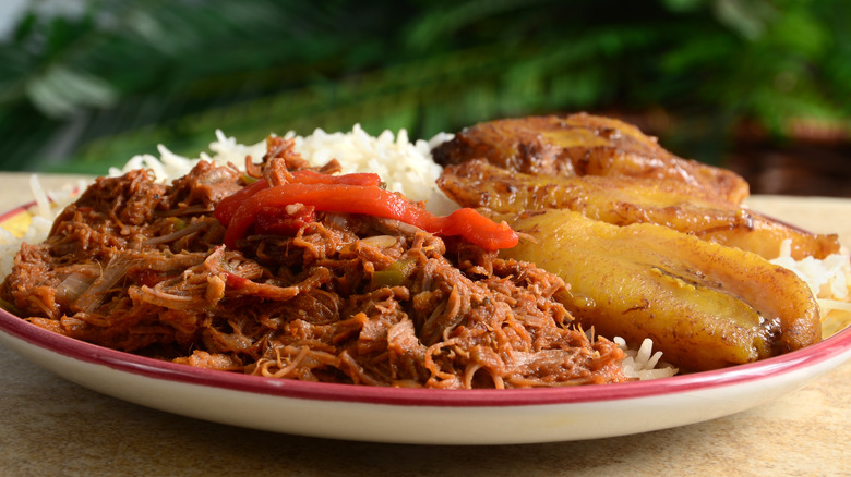 ropa vieja with rice and fried plantains