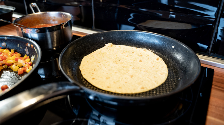 Corn tortillas in a pan