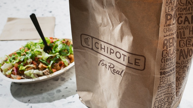 Chipotle paper bag and burrito bowl