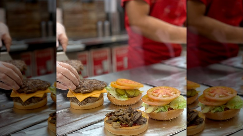 Five Guys employees preparing burgers