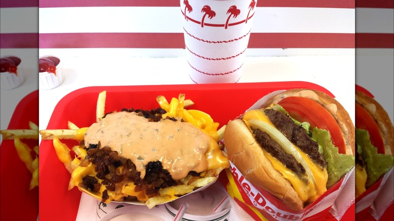 In-N-Out double cheeseburger, animal-style fries, and drink on red tray