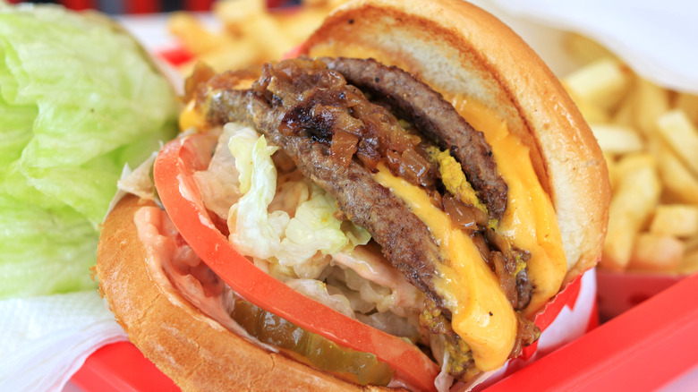 A cheeseburger with toppings