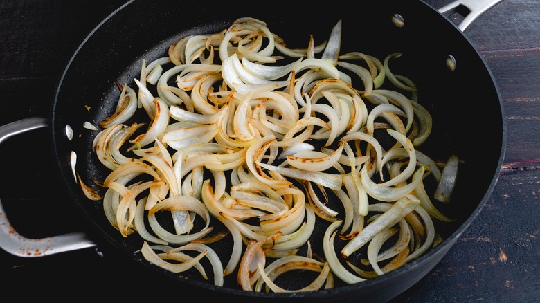 sauteing onions in pan