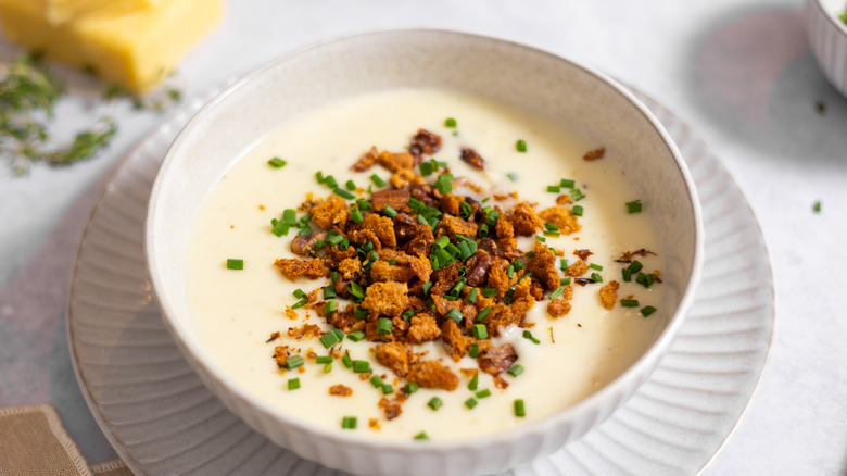 Cheesy roasted garlic soup with sourdough crumble