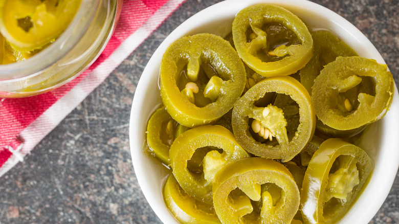 Pickled jalapeños in ramekin  