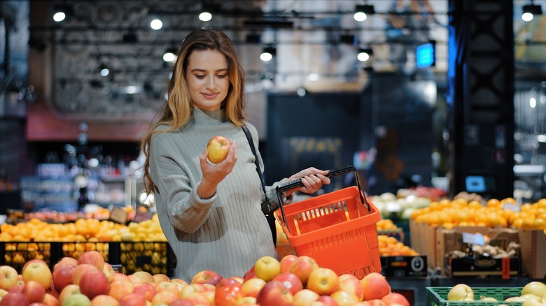 Woman shopping for apples