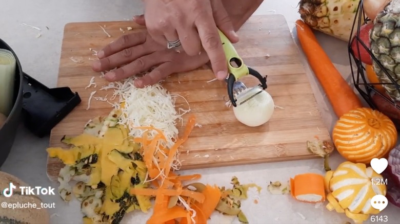 Vegetable peeler cutting onion