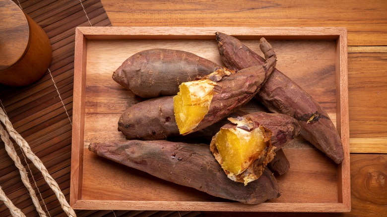 Baked sweet potatoes on wooden table