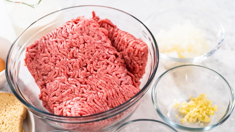 Ground meat mixture and binders in glass bowls