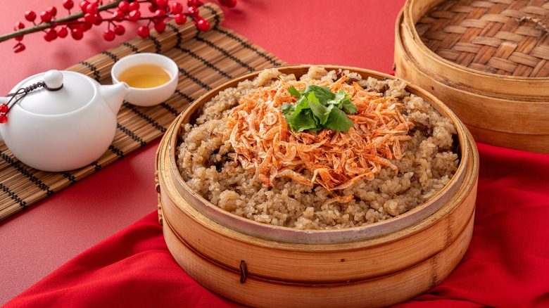 traditional Chinese savory sticky rice in a bamboo steamer basket