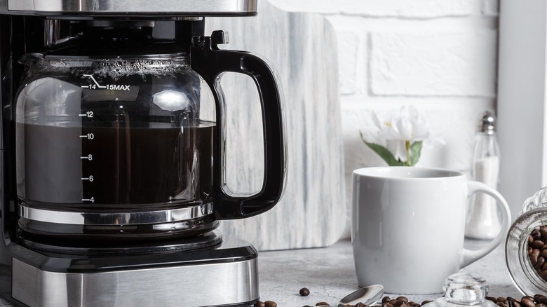 Smiling woman enjoying a mug of coffee