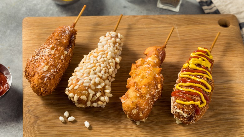Corn dogs with various toppings