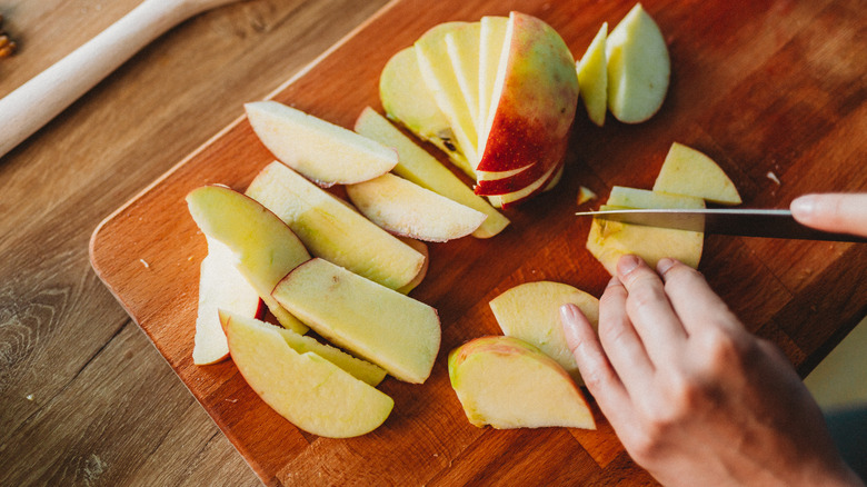 cutting apples on cutting board