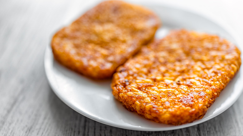 Crispy hash browns on plate