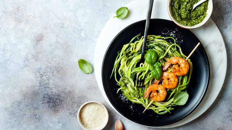 Zucchini noodles with shrimp, pesto, and basil