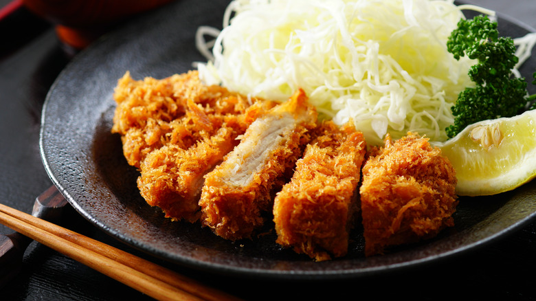 tonkatsu cutlet with lemon and other garnishes