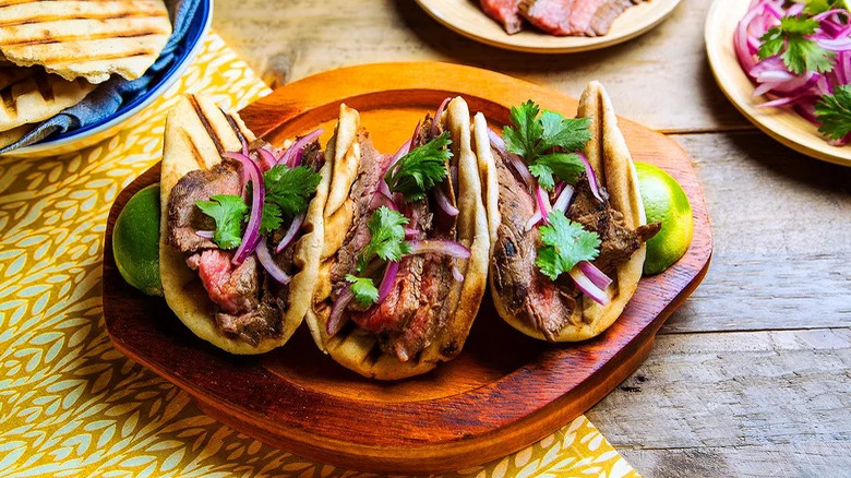 steak tacos in grilled naan