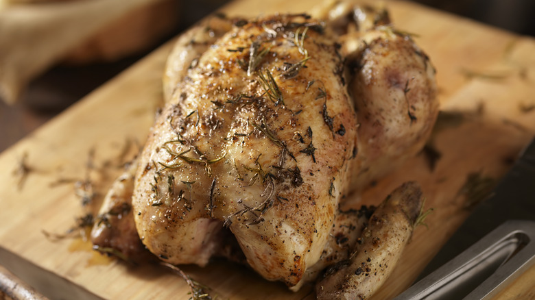 Roasted chicken on cutting board