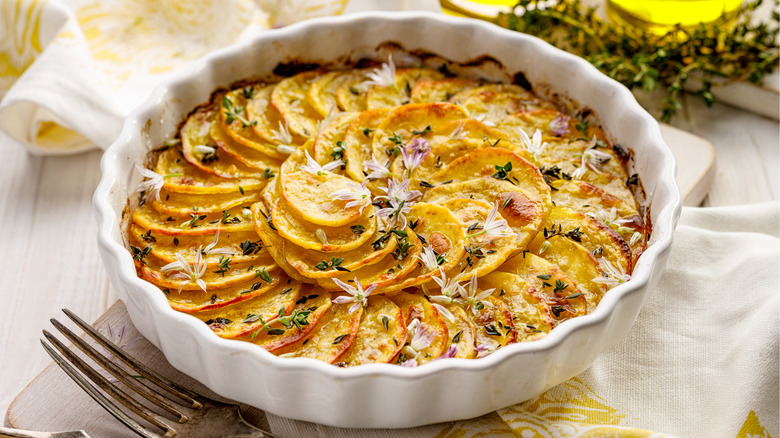 scalloped potatoes in a circle dish