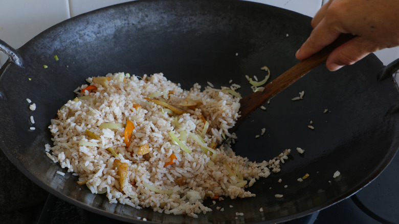 cooking fried rice in wok