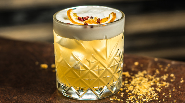 orange garnished whiskey sour