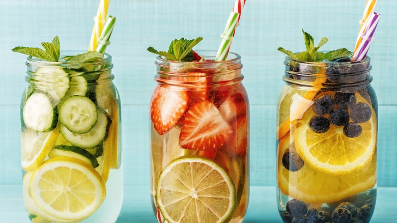 Fruit infused water in three glass jars