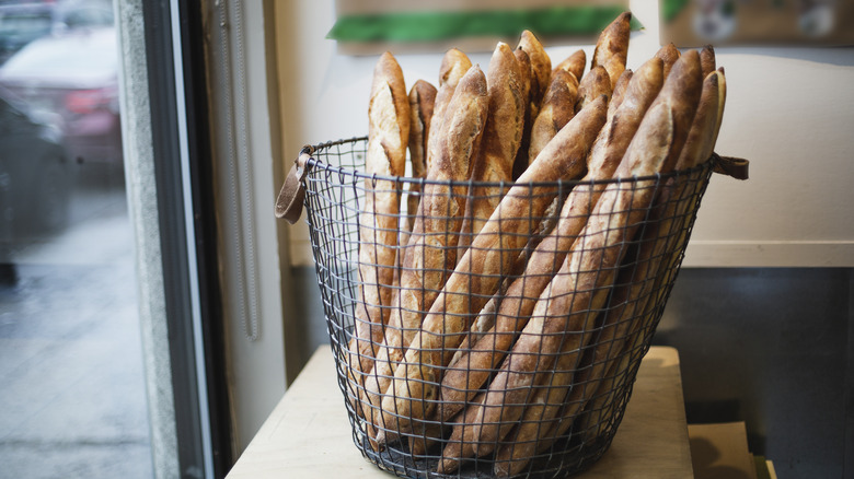 baguettes in a bakery basket on counter