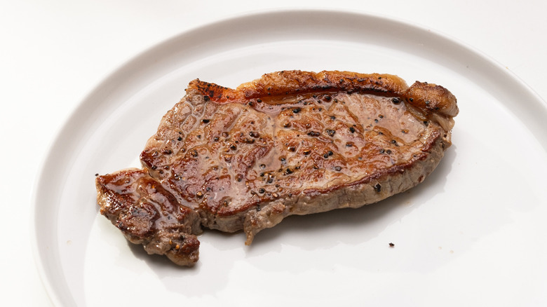 steak resting on a plate