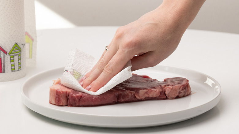 patting a steak dry