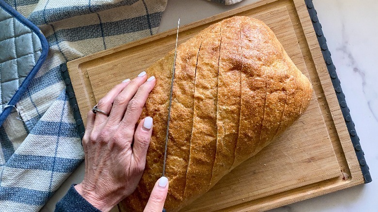 slicing bread on cutting board