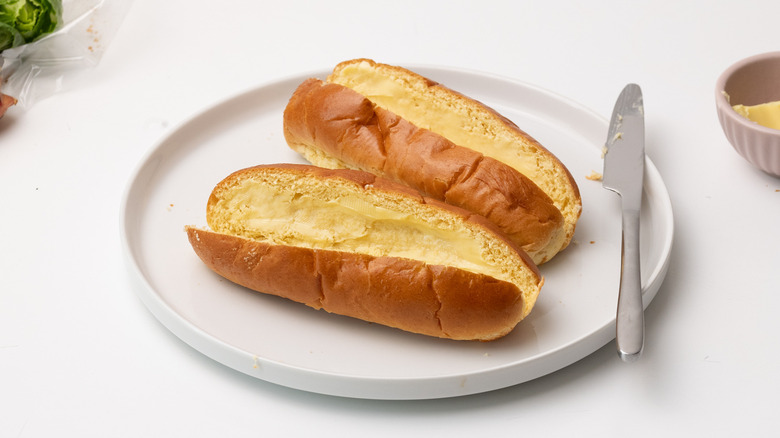 buttered bread buns on plate