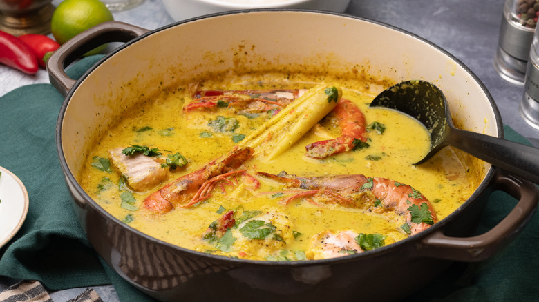 serving coconut fish curry