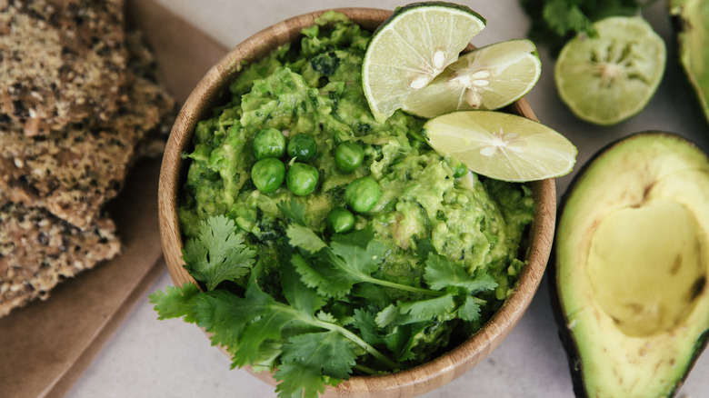 Bowl of guacamole with coriander and lime