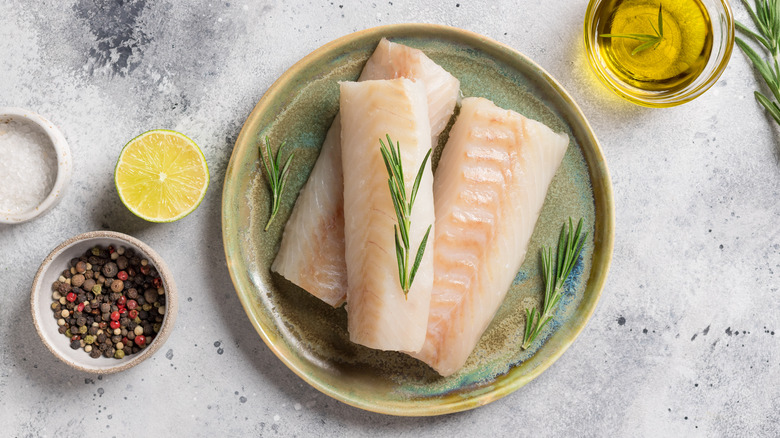 raw cod filets on plate