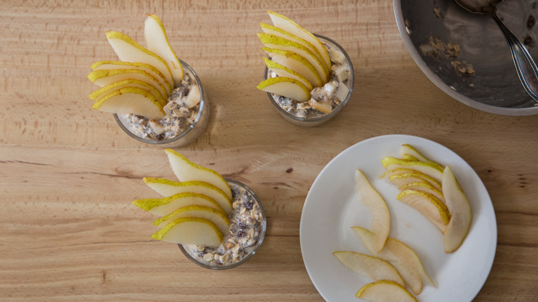 3 glasses of overnight oats on wood table