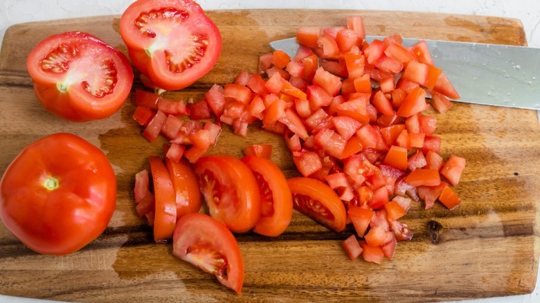 diced tomatoes on cutting board