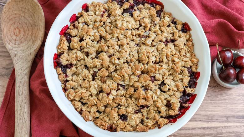 baked fresh summer cherry crisp on a table