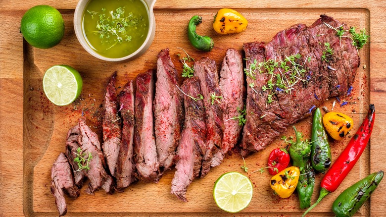 steak and salsa on cutting board