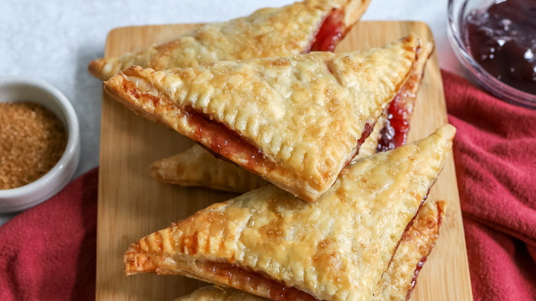 cherry turnovers on wooden board