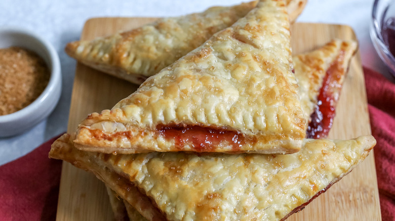 cherry turnovers on wooden board