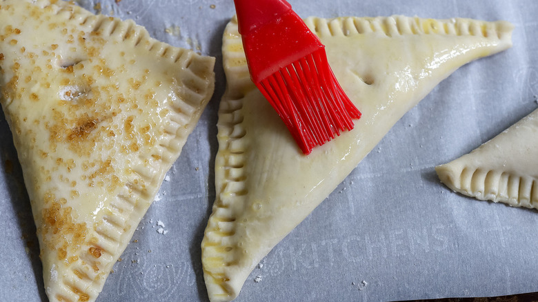 pastry brush on unbaked turnover