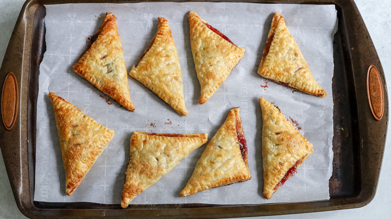 baked turnovers on baking sheet