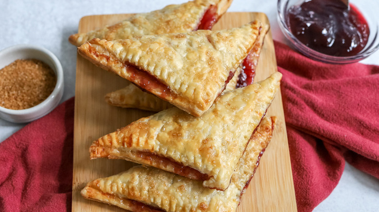 cherry turnovers on wooden board