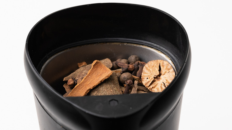 Whole spices in a grinder